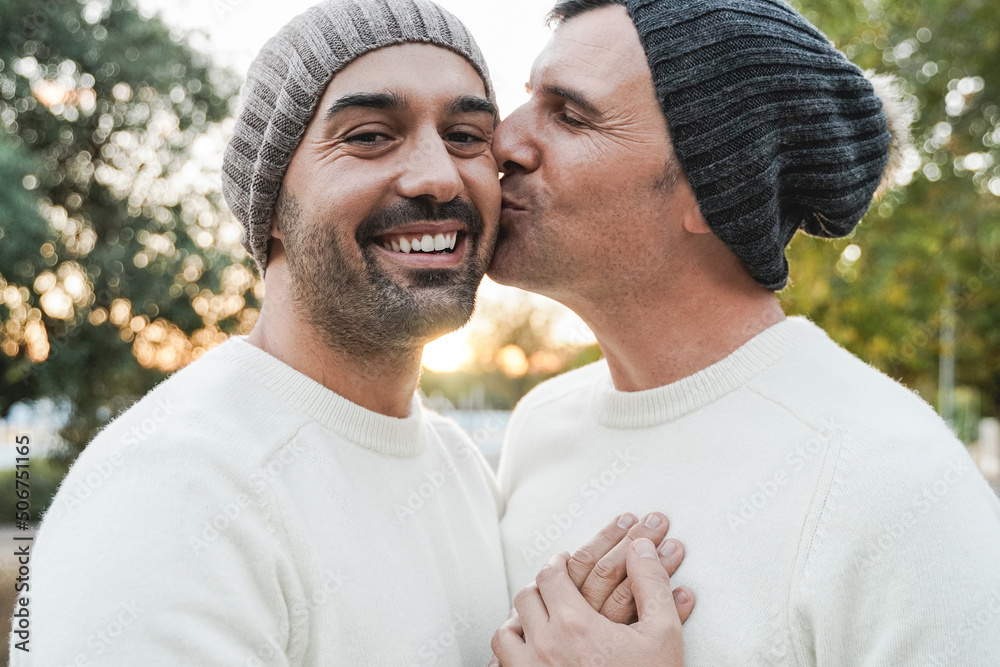 Fototapeta premium Mature gay men couple having tender moment outdoor - Focus on left man face