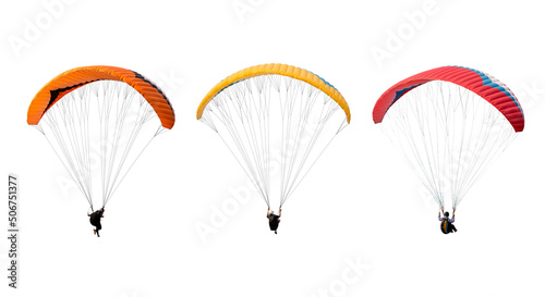collection Bright colorful parachute isolated on white background,  The sportsman flying on a paraglider. Concept of extreme sport, taking adventure challenge. photo
