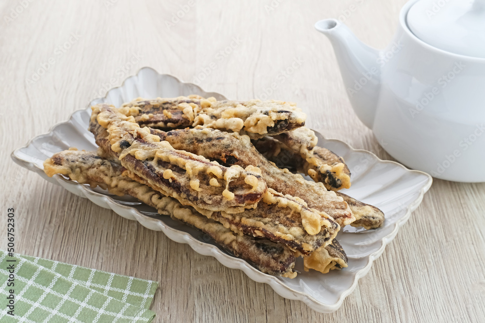 Sale Pisang, Indonesian traditional snack made from bananas that are cut into thin strips, dried in the sun, then fried in flour.
Sale Pisang, Indonesian traditional snack made from bananas that are cut into thin strips, dried in the sun, then fried in flour.