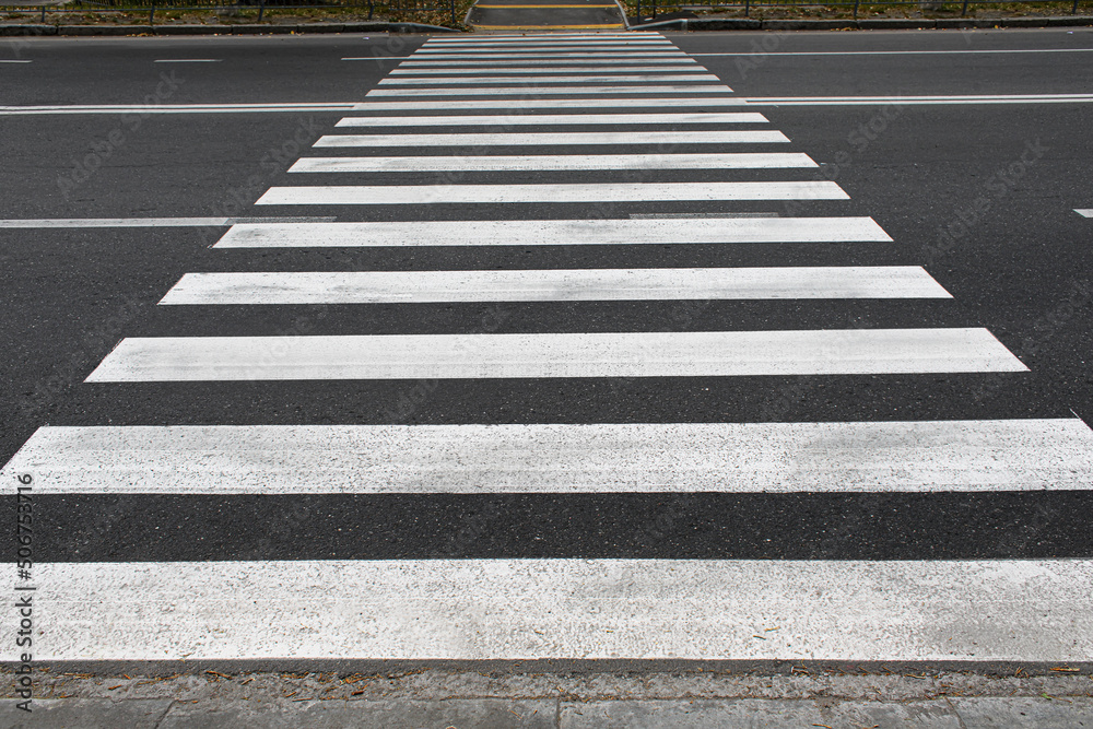 Pedestrian crossing on asphalt road Pedestrian crossing on asphalt road