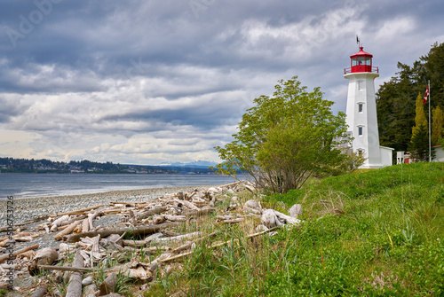 Cape Mudge Lighthouse Quadra Island BC. The Cape Mudge Lighthouse on Quadra Island overlooking Discovery Passage and Campbell River on the far shore. BC, Canada.

 photo