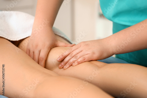 Young woman having anti-cellulite massage in beauty salon