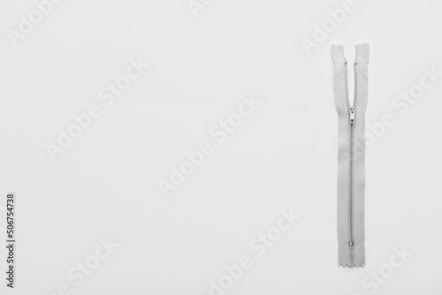 Stylish grey zipper on white background