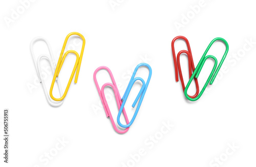 Colorful paper clips on white background, top view photo
