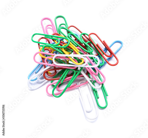 Colorful paper clips on whi...