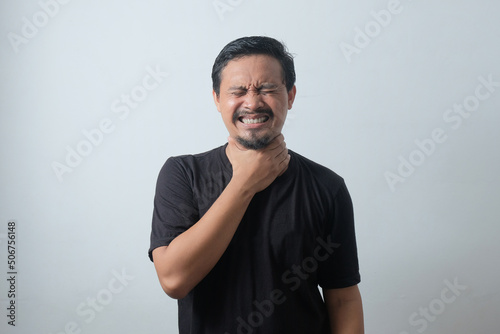 portrait asian young man suffering sore throat