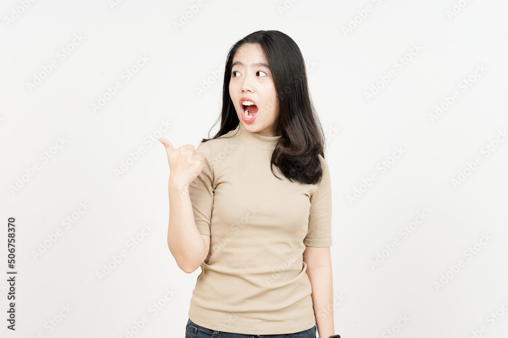 Presenting and Pointing Side Product Using Thumb Of Beautiful Asian Woman Isolated On White Presenting and Pointing Side Product Using Thumb Of Beautiful Asian Woman Isolated On White