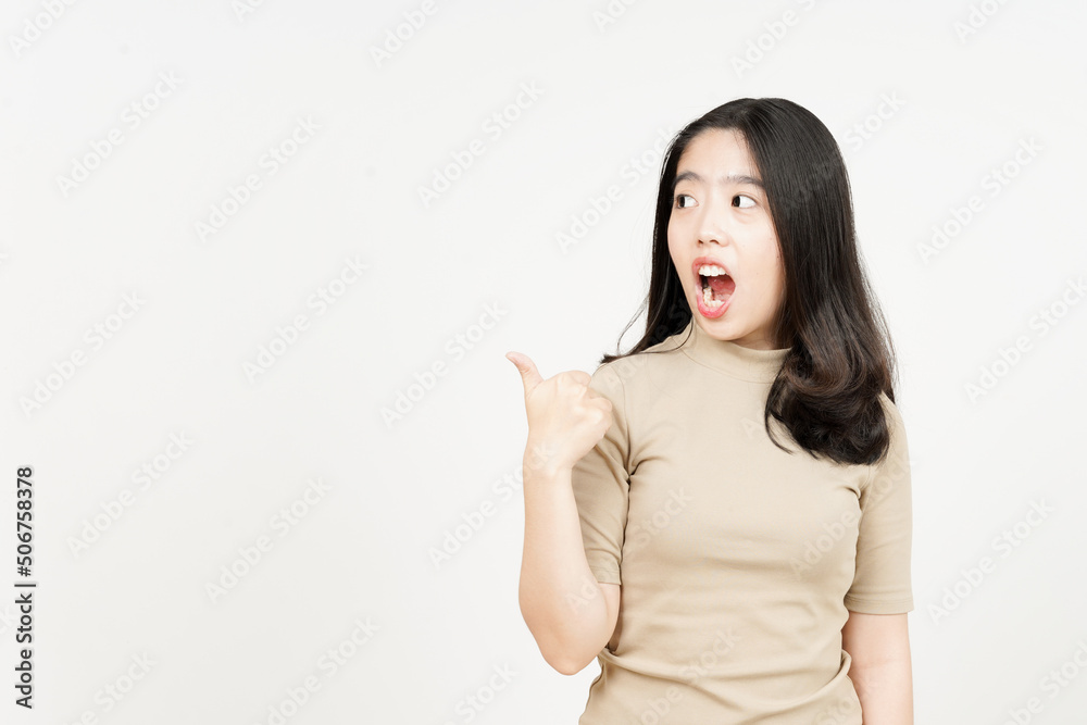 Presenting and Pointing Side Product Using Thumb Of Beautiful Asian Woman Isolated On White Presenting and Pointing Side Product Using Thumb Of Beautiful Asian Woman Isolated On White