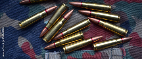 Ammunition 7,62x39 with camo background photo