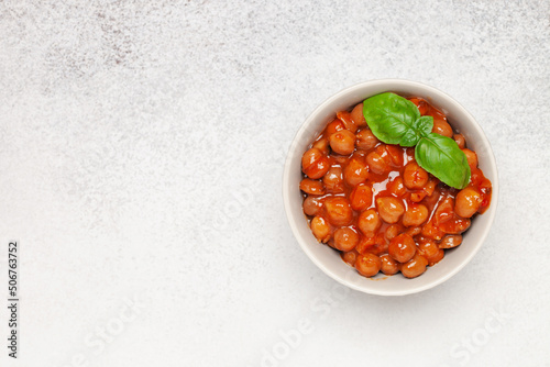 Piquant boiled  chickpeas in a sauce with pepper and prunes. Vegetarian or vegan food. Top view
