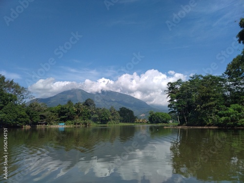 Photo of the scenery around the Cangkuang tourist spot taken on a raft