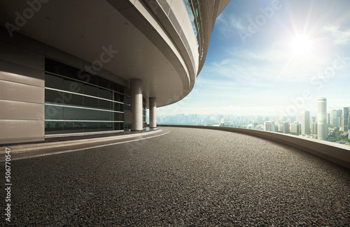 Modern architecture with empty tarmac road. 3D Rendering