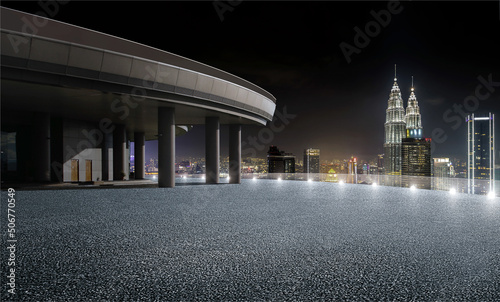 Rooftop view urban cityscape skyline night scene with empty asphalt floor on front. 3D Rendering