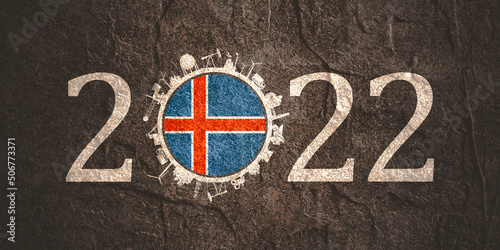 2022 year number with industrial icons around zero digit. Flag of Iceland.