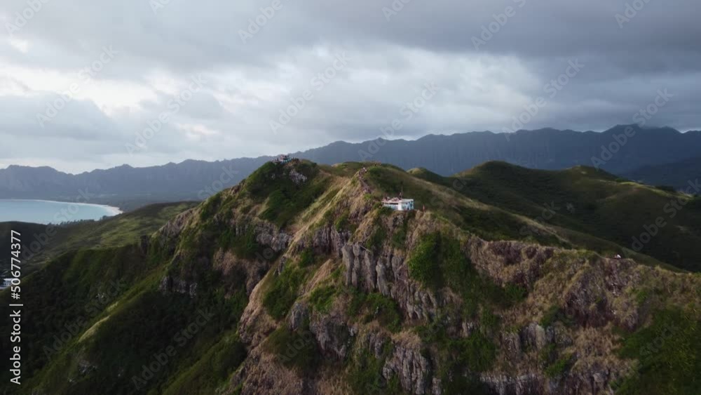 Cinematic sunrise drone shot of the WWII pillboxes overlooking the ocean near Lanikai Beach on the Hawaiian Island of Oahu. This dramatic scene was filmed with a DJI Mini 2 drone. Cinematic sunrise drone shot of the WWII pillboxes overlooking the ocean near Lanikai Beach on the Hawaiian Island of Oahu. This dramatic scene was filmed with a DJI Mini 2 drone.
