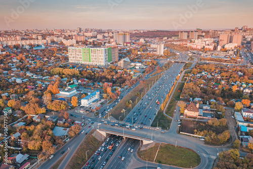 City crossroads and overpasses with traffic aerial view. Transport in the busy city concept © EdNurg