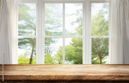 Empty table wooden behind is a window background, for your photo montage or product display, Space for placing items on the table, product and food display.