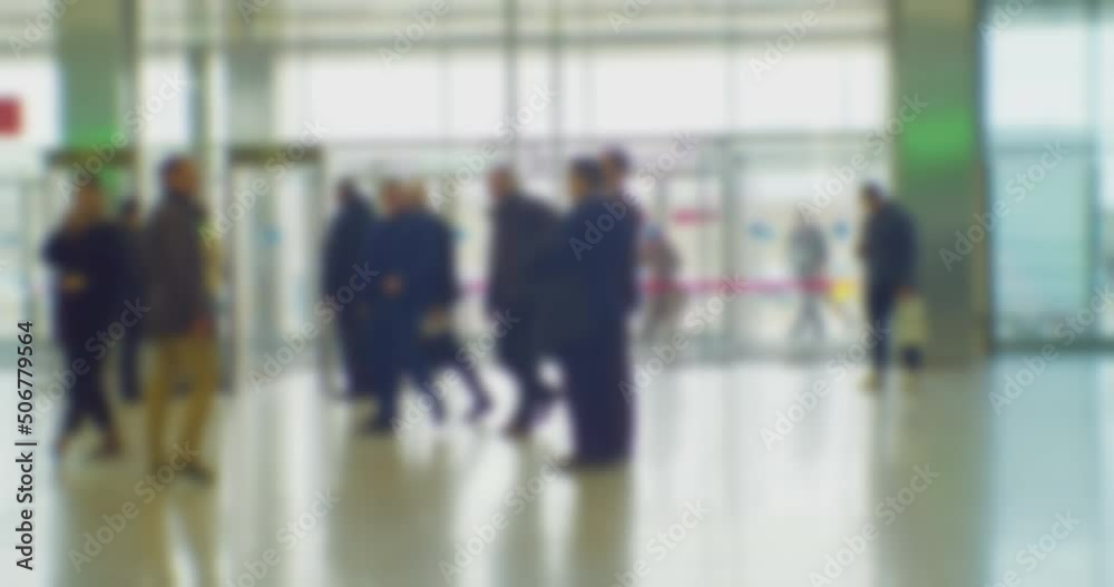 time lapse. modern business life. defocused blurry video. background on the theme of business. blurred silhouettes of unrecognizable people walking in a large hall. time lapse. modern business life. defocused blurry video. background on the theme of business. blurred silhouettes of unrecognizable people walking in a large hall.