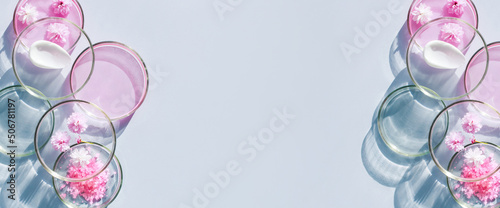 Petri dishes with cosmetic samples on a light background with space for text photo