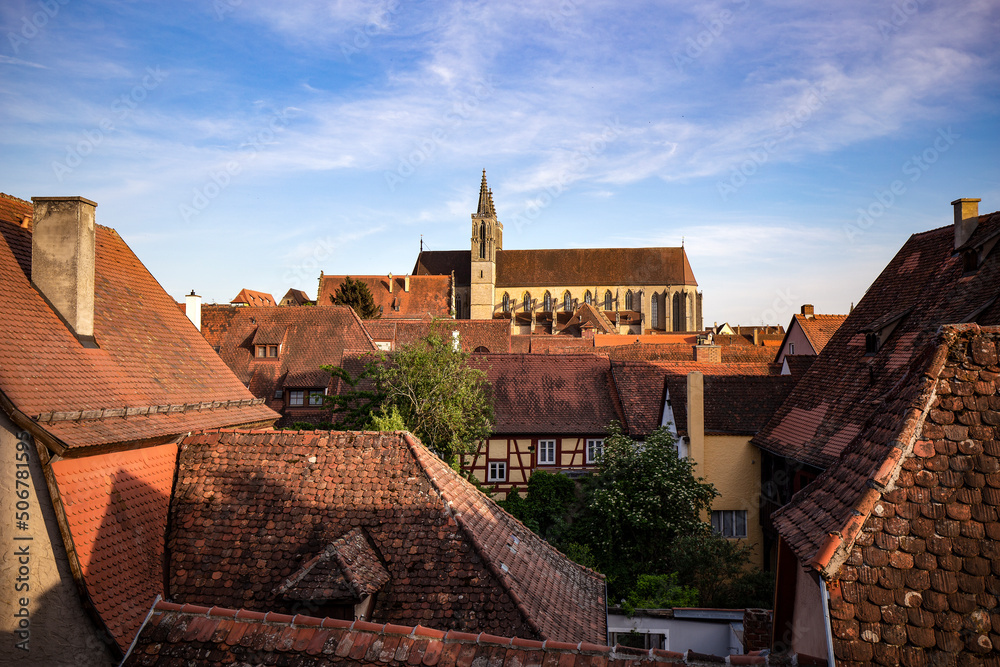 Panoramic view of Rothenburg ob der Tauber on a beautiful day in Bavaria, Germany. View of the rooftops of the famous well preserved medieval old town where St. James Church stands out