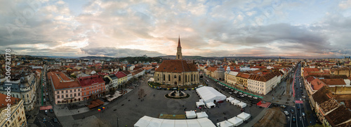 Aerial drone panoramic view of Saint Michael Church in Cluj at sunset, Romania