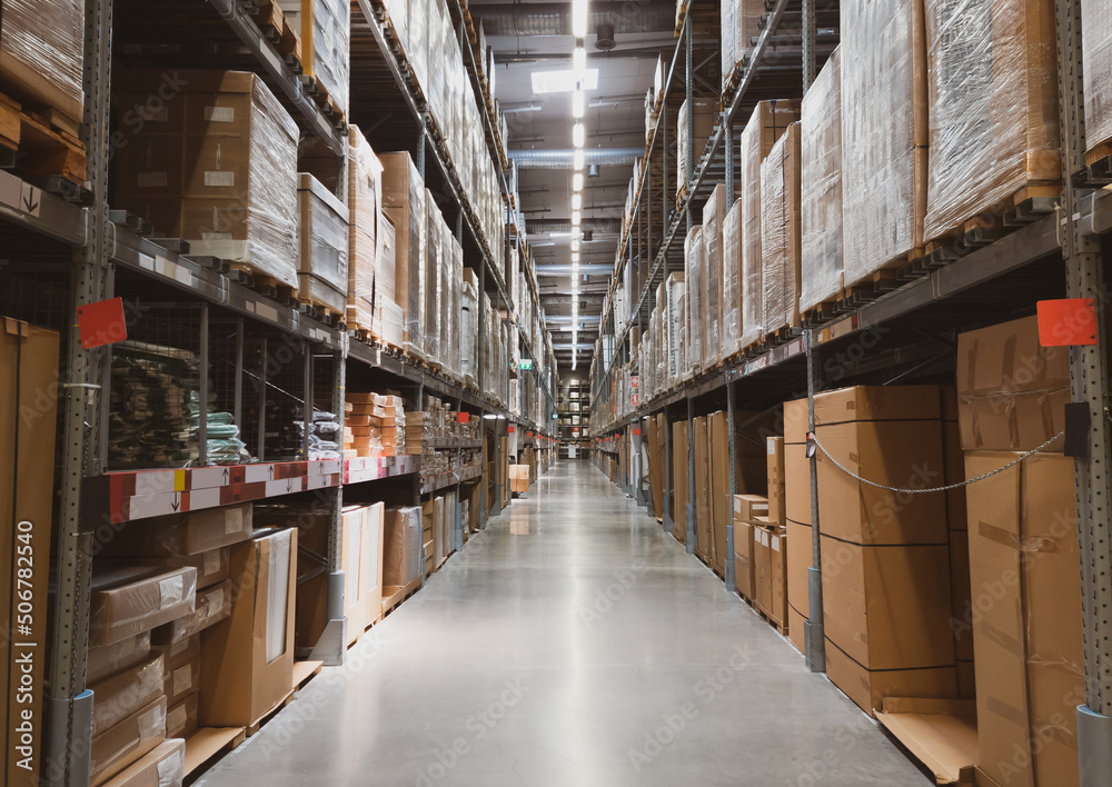 Distribution warehouse interior. Shelve with boxes in modern factory warehouse. Distribution warehouse interior. Shelve with boxes in modern factory warehouse.