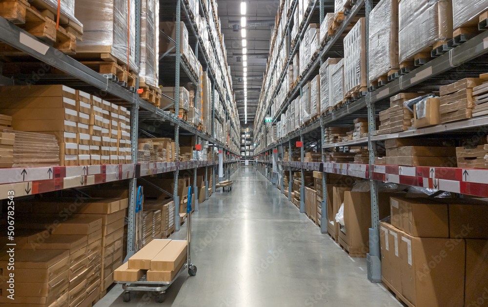 Distribution warehouse interior. Shelve with boxes in modern factory warehouse.