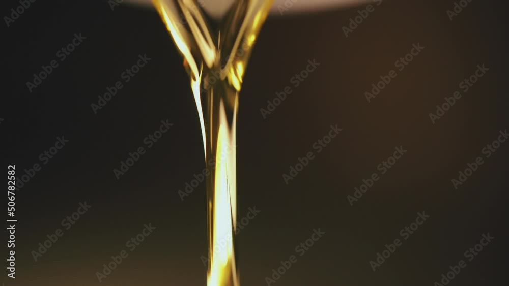 Slow Motion Shot of Pouring Oil Liquid. Slow Motion Shot of Pouring Oil Liquid.