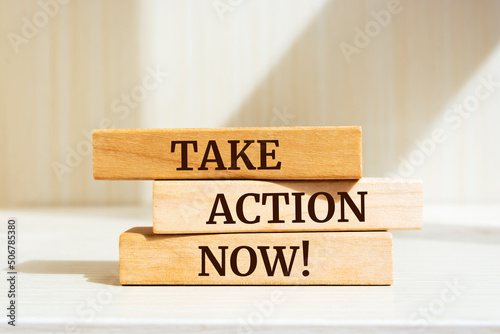 Wooden blocks with words 'Take action now!'. Business concept.