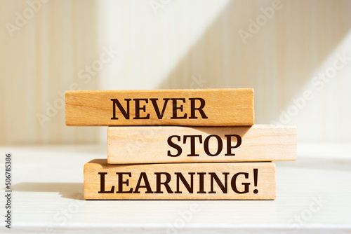 Slika na platnu Wooden blocks with words 'NEVER STOP LEARNING!'.