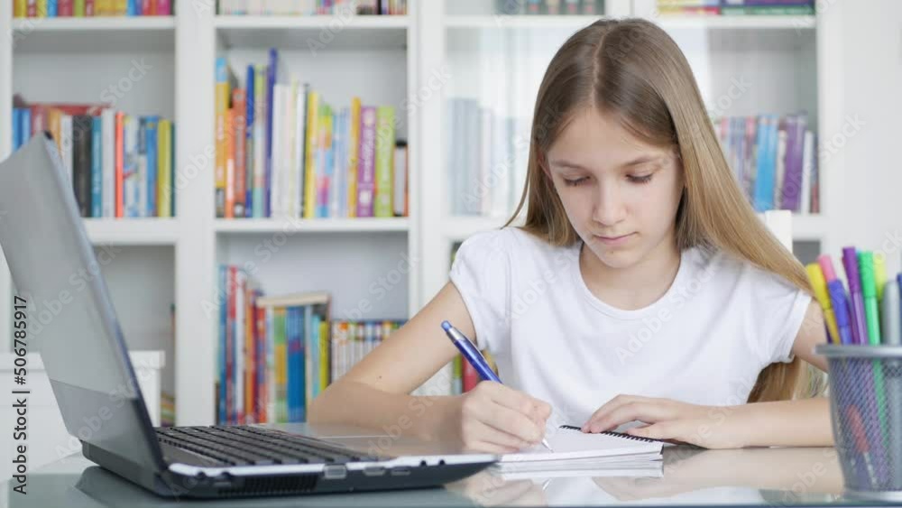 Kid Studying on Laptop in Coronavirus Pandemic, Child Learning, Writing Home, Schoolgirl Teenager Homeschooling, Online Education Kid Studying on Laptop in Coronavirus Pandemic, Child Learning, Writing Home, Schoolgirl Teenager Homeschooling, Online Education