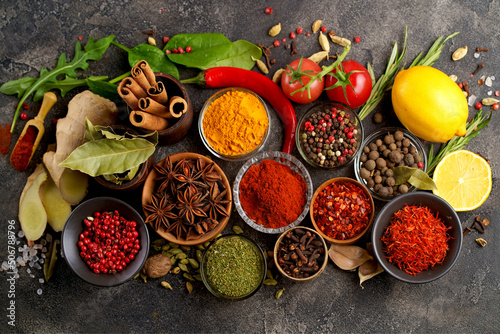 Assortment of natural spices on dark rustic stone background, Healthy spice concept