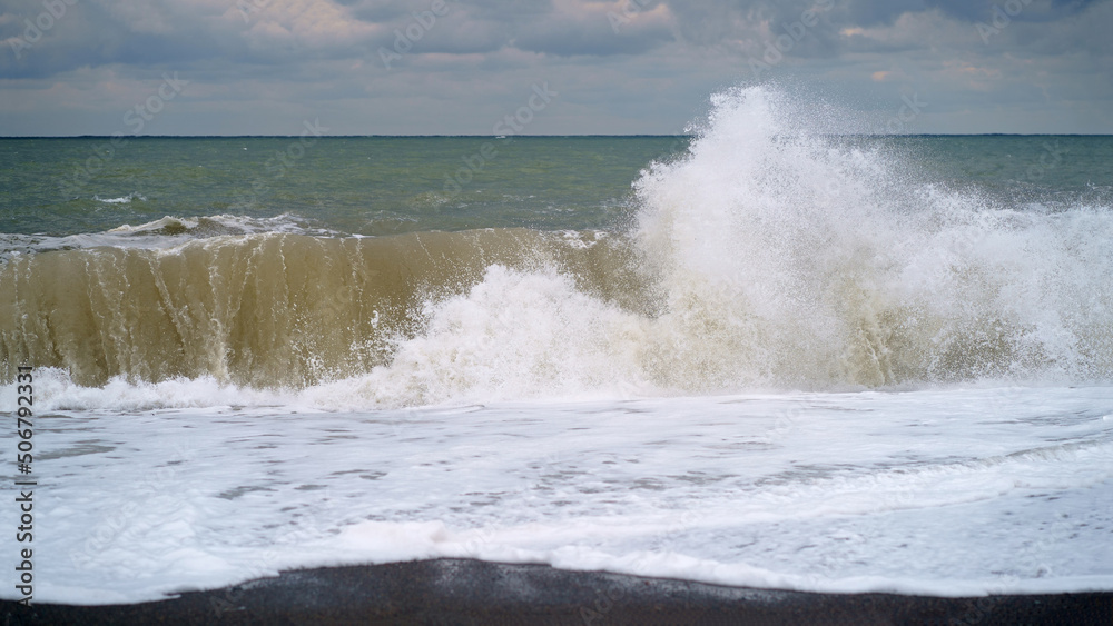 Large sea wave. The sea is stormy. Cold stormy Black Sea coast, Georgia.