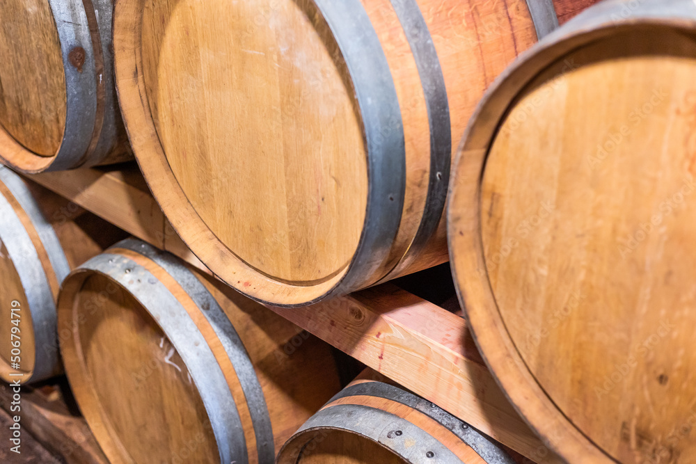 A wine cellar full of barrels of wine, alcohol concept