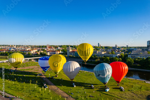 Aerial spring evening view of rising hot air balloons over the city of Vilnius, Fototapet
