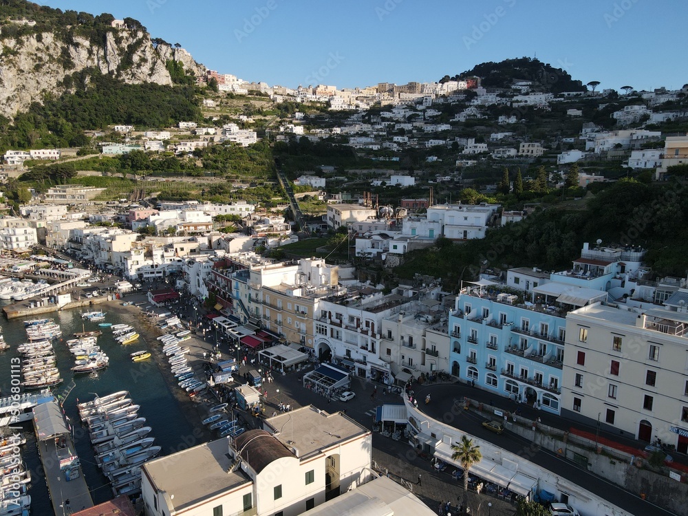 Aerial view of Marina Grande in Capri, an island located in the Tyrrhenian Sea off the Sorrento Peninsula, on the south side of the Gulf of Naples in the Campania region of Italy. Drone view of Capri.