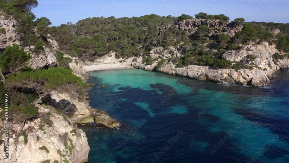 Aerial drone video of tropical paradise turquoise beach in Mediterranean destination. Menorca, Mallorca, Spain. Aerial drone video of tropical paradise turquoise beach in Mediterranean destination. Menorca, Mallorca, Spain.