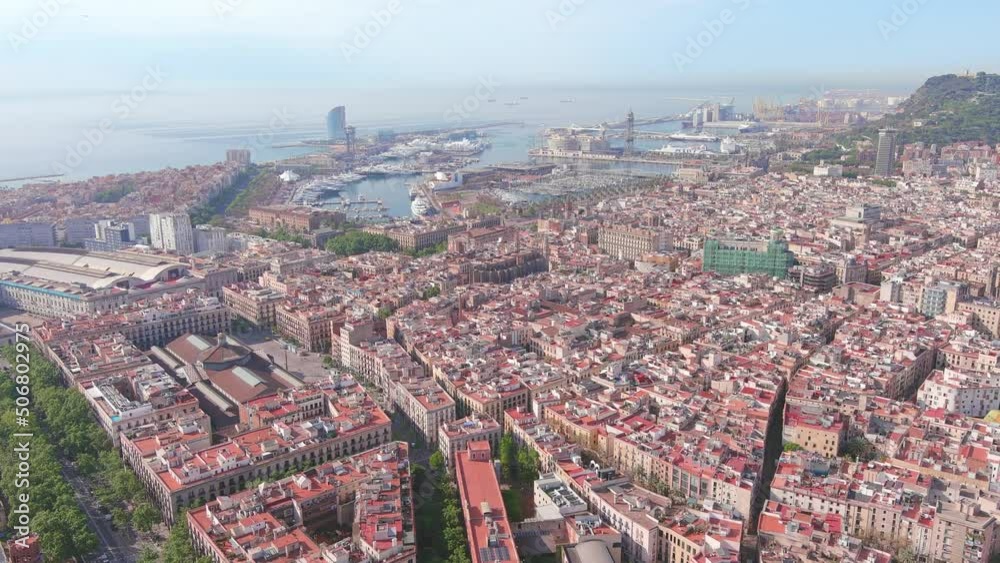 Barcelona, Spain: Aerial view of capital city of Catalonia, city port with marina and harbor with industrial buildings, sunny day - landscape panorama of Europe from above Barcelona, Spain: Aerial view of capital city of Catalonia, city port with marina and harbor with industrial buildings, sunny day - landscape panorama of Europe from above