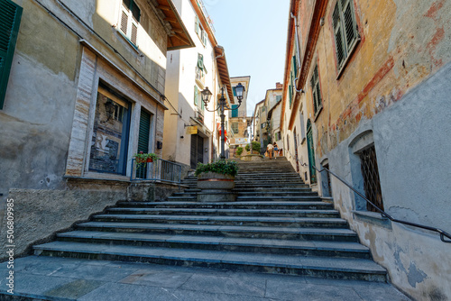 Ovada, Piedmont, Italy - June 27, 2021: staircase leading from Piazza Castello to the historic center of the town © Marco