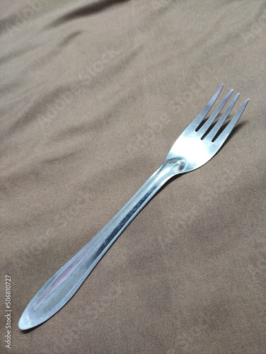 Silver fork without pattern. Photo. kitchen items. object. Silver. to eat.