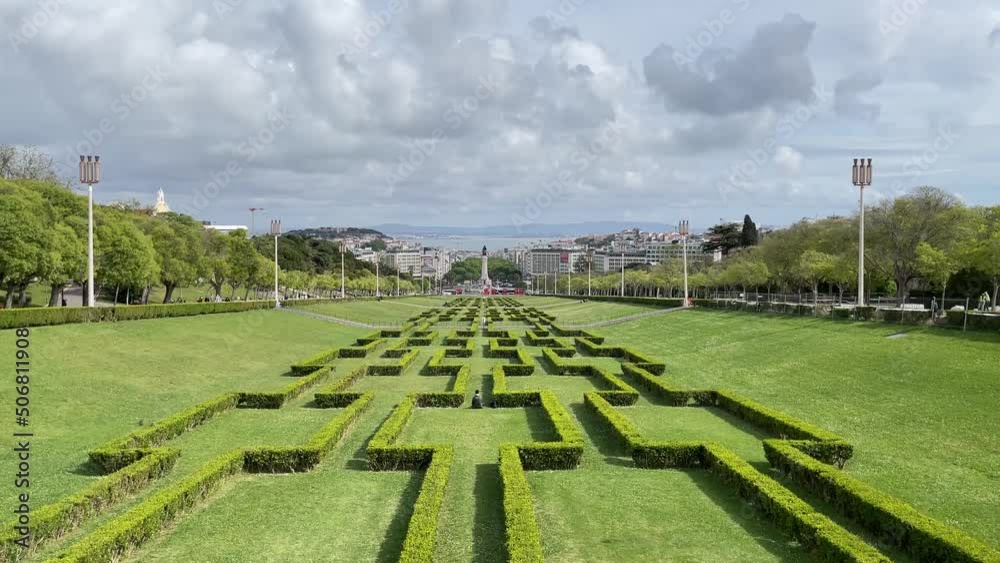 Tilt up shot of Parque Eduardo VII park agains cityscape and Tejo River Tilt up shot of Parque Eduardo VII park agains cityscape and Tejo River
