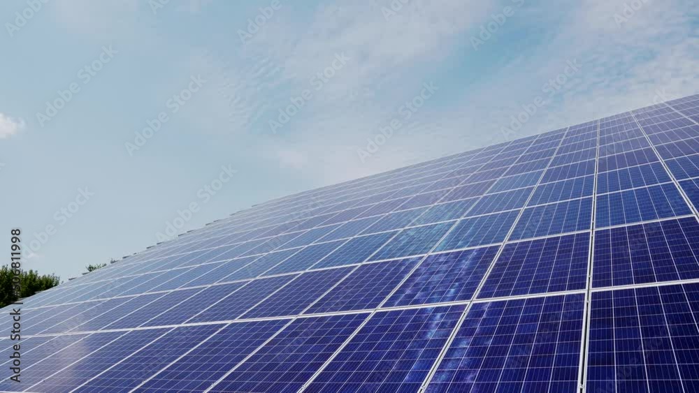 Modern photovoltaic solar battery wall. Energy solar panels installed on rooftop. Concept for ecology. Blue sky background. Modern photovoltaic solar battery wall. Energy solar panels installed on rooftop. Concept for ecology. Blue sky background.