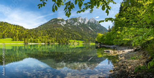 The Wilder Kaiser mountain range is reflected in the idyllic Hinterseiner See, Tyrol, Austria, Europe photo