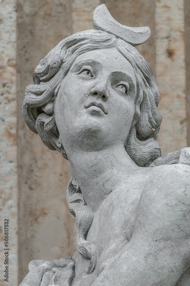 Cover page with an old statue of ancient sensual Renaissance Era woman in Potsdam, Germany, details, closeup.