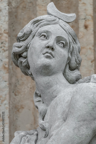 Cover page with an old statue of ancient sensual Renaissance Era woman in Potsdam, Germany, details, closeup.