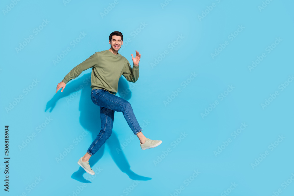 Full body photo of excited crazy person hurry rush fast empty space isolated on blue color background