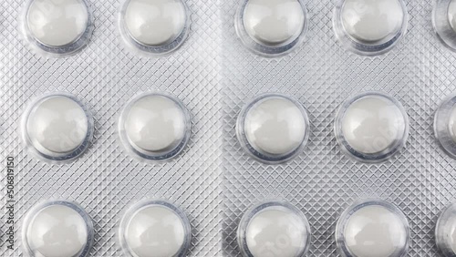 Colorful pills and capsules tablets in blister pack organized with beautiful pattern with torch light. The concept of the pharmaceutical industry. Pharmacy. Antibiotic resistance.