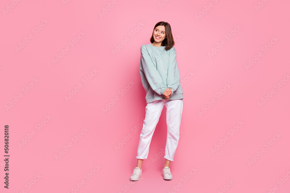 Full body photo of young pretty lady wonder look empty space modern outfit isolated over pink color background Full body photo of young pretty lady wonder look empty space modern outfit isolated over pink color background