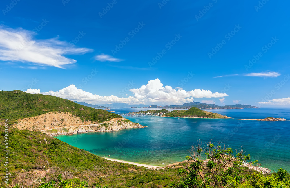Nha Trang Bay summer days with sea light blue, cool, temperate climate, recognized most beautiful bays national scenic Vietnam, boats avoid storm far when rainy season comes.