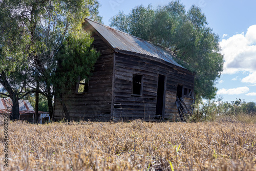 Abandoned old workers cottage in outback Queensland made of weatherboard or clapboard.
